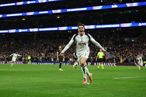 Tottenham's Joao Palhinha celebrates after scoring his side's fourth goal during the Champions League opening phase soccer match between Tottenham and Copenhagen, in London, England.