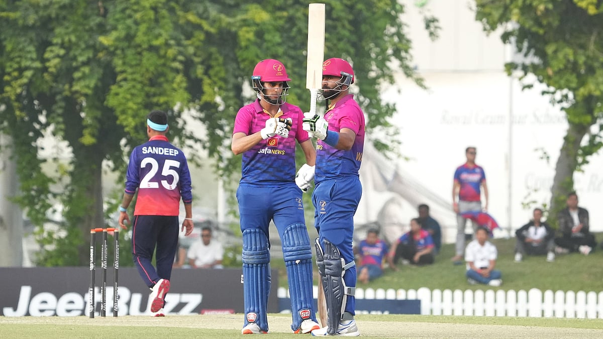 | Photo: X/EmiratesCricket : United Arab Emirates' Muhammad Waseem celebrates his half-century with Muhammad Shahdad against Nepal in ICC Cricket World Cup League 2 match on November 5, 2025.
