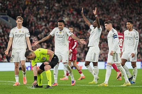 Real Madrid players argue with a referee during the Champions League soccer match between Liverpool and Real Madrid in Liverpool, England.