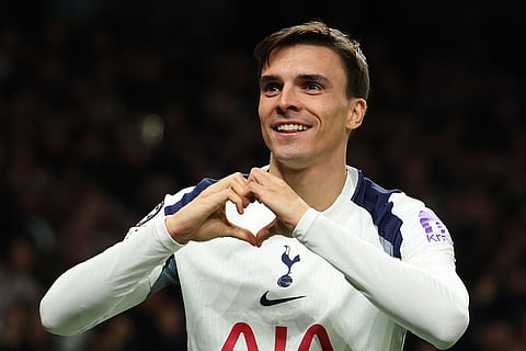 Tottenham's Joao Palhinha celebrates after scoring his side's fourth goal during the Champions League opening phase soccer match between Tottenham and Copenhagen, in London, England.