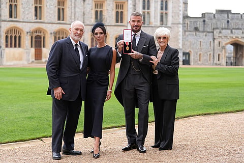 Sir David Beckham, with his wife Lady Victoria and parents Ted and Sandra Beckham, after he was made a Knight Bachelor at an investiture ceremony at Windsor Castle, Berkshire, England.