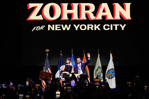 Mayor-elect Zohran Mamdani, right, and his wife Rama Duwaji react to supporters during an election night watch party in New York. 