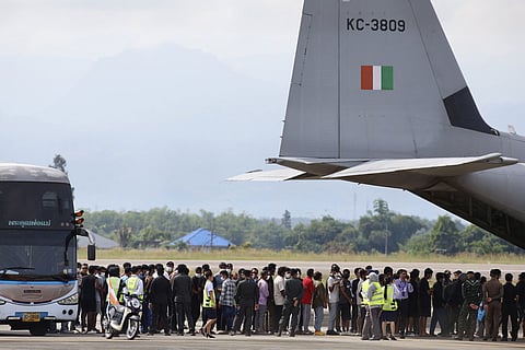 India nationals, believed to have worked at scam center in Myanmar, board a plane at Thailand's Mae Sot International Airport in Tak, before being sent back to India.