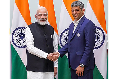 Prime Minister Narendra Modi with ODI World Cup winning women's cricket team head coach Amol Muzumdar during a meeting, at his residence in New Delhi. 