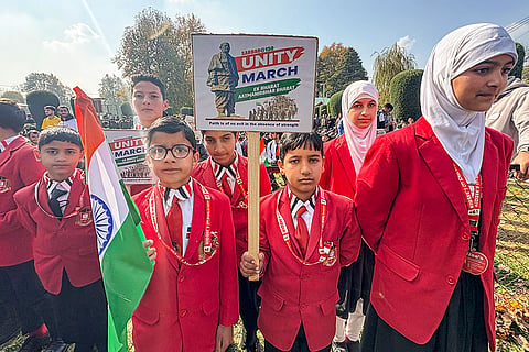 School students take part in a 'Unity March' organised to mark the 150th birth anniversary of Sardar Vallabhbhai Patel, in Anantnag, Jammu and Kashmir.