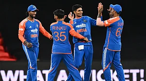 | Photo: AAPImage/Dave Hunt via AP : Indian players celebrate after winning the a T20 cricket international against Australia in Carrara, Australia, Thursday, Nov. 6, 2025.