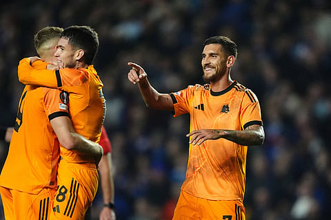 Roma's Lorenzo Pellegrini celebrates scoring during the Europa League soccer match between Rangers and Roma in Glasgow, Scotland,.
