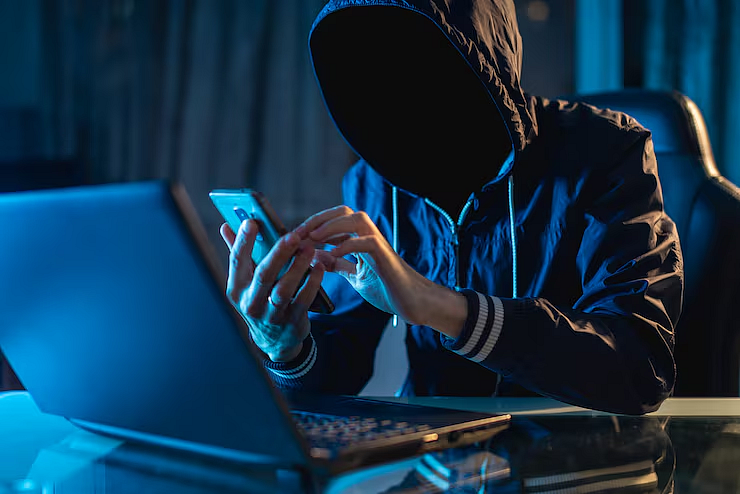 A person in hoodie using phone