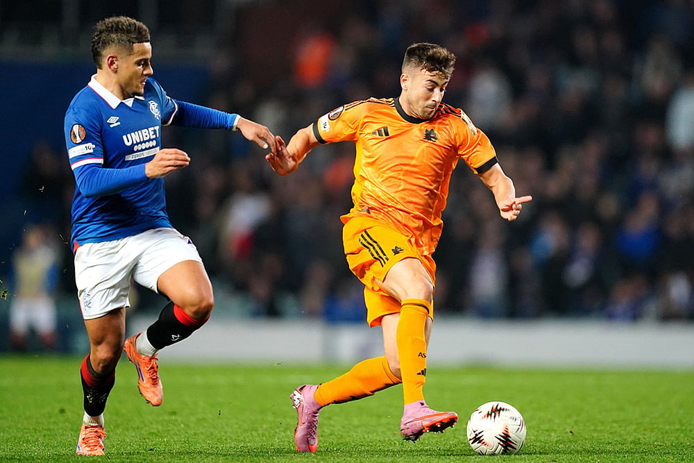 | Photo: Jane Barlow/PA via AP : Rangers' Max Aarons, left, and Roma's Stephan El Shaarawy in action during the Europa League soccer match between Rangers and Roma in Glasgow, Scotland.