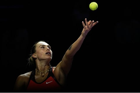 Aryna Sabalenka of Belarus serves against Coco Gauff of the United States during their women's singles match at the WTA tennis finals in Riyadh, Saudi Arabia.