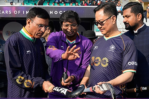Union Minister for Sports Mansukh Mandaviya with Union Minister Kiren Rijiju and others during the Hockey India centenary celebrations, at Major Dhyan Chand National Stadium, in New Delhi.