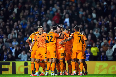 Roma's Matias Soule, center, celebrates scoring with teammates during the Europa League soccer match between Rangers and Roma in Glasgow, Scotland.