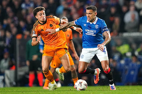 Roma's Neil El Aynaoui and Rangers' James Tavernier, right, in action during the Europa League soccer match between Rangers and Roma in Glasgow, Scotland.