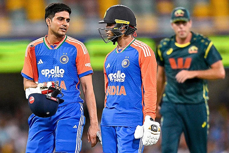 Photo: PTI/Izhar Khan : India's Shubman Gill, left, and Abhishek Sharma return to pavilion as rain stops play during the fifth T20I cricket match of a series between India and Australia, in Brisbane. 