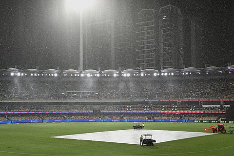 Rain falls during a T20 cricket international between India and Australia in Brisbane, Australia.