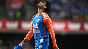 | Photo: Dave Hunt/AAPImage via AP : Abhishek Sharma of India reacts after dropping a catch during a T20 cricket international between India and Australia in Carrara, Australia.