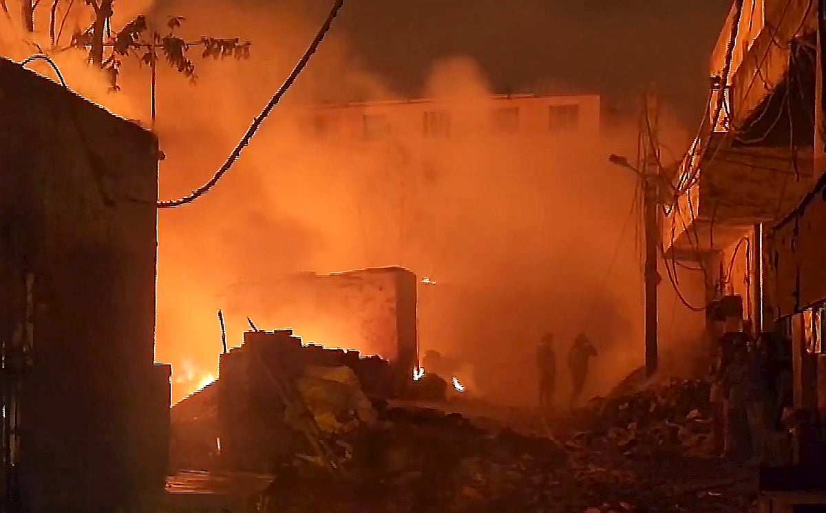 PTI : A fire breaks out in a cluster of huts near Rithala metro station at Rohini area, in New Delhi, early Saturday, Nov. 8, 2025.
