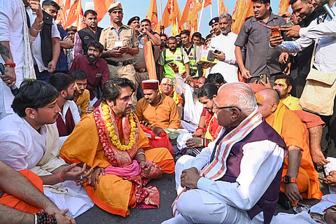 In this image, Union Minister Manohar Lal meets spiritual leader Dhirendra Krishna Shastri during the 'Sanatan Hindu Ekta Padyatra', in Faridabad.