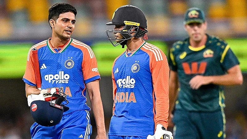 Photo: PTI/Izhar Khan : India's Shubman Gill, left, and Abhishek Sharma return to pavilion as rain stops play during the fifth T20I cricket match of a series between India and Australia, in Brisbane. 