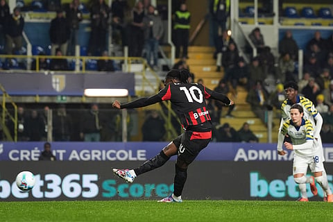 AC Milan's Rafael Leao scores on a penalty during the Serie A soccer match between Parma and Milan in Parma, Italy.