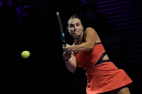 Aryna Sabalenka of Belarus plays a backhand return to Elena Rybakina of Kazakhstan during their women's final singles match of the WTA finals in Riyadh, Saudi Arabia.