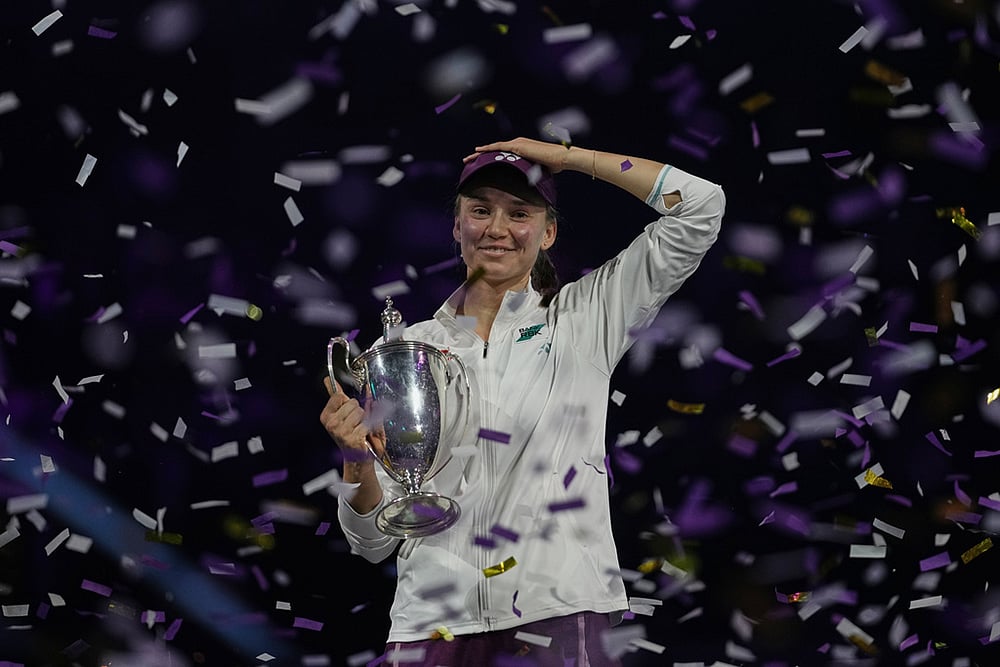 | Photo: AP/Fatima Shbair : Elena Rybakina of Kazakhstan celebrates with her trophy after defeating Aryna Sabalenka of Belarus in the women's final singles match of the WTA finals in Riyadh, Saudi Arabia.