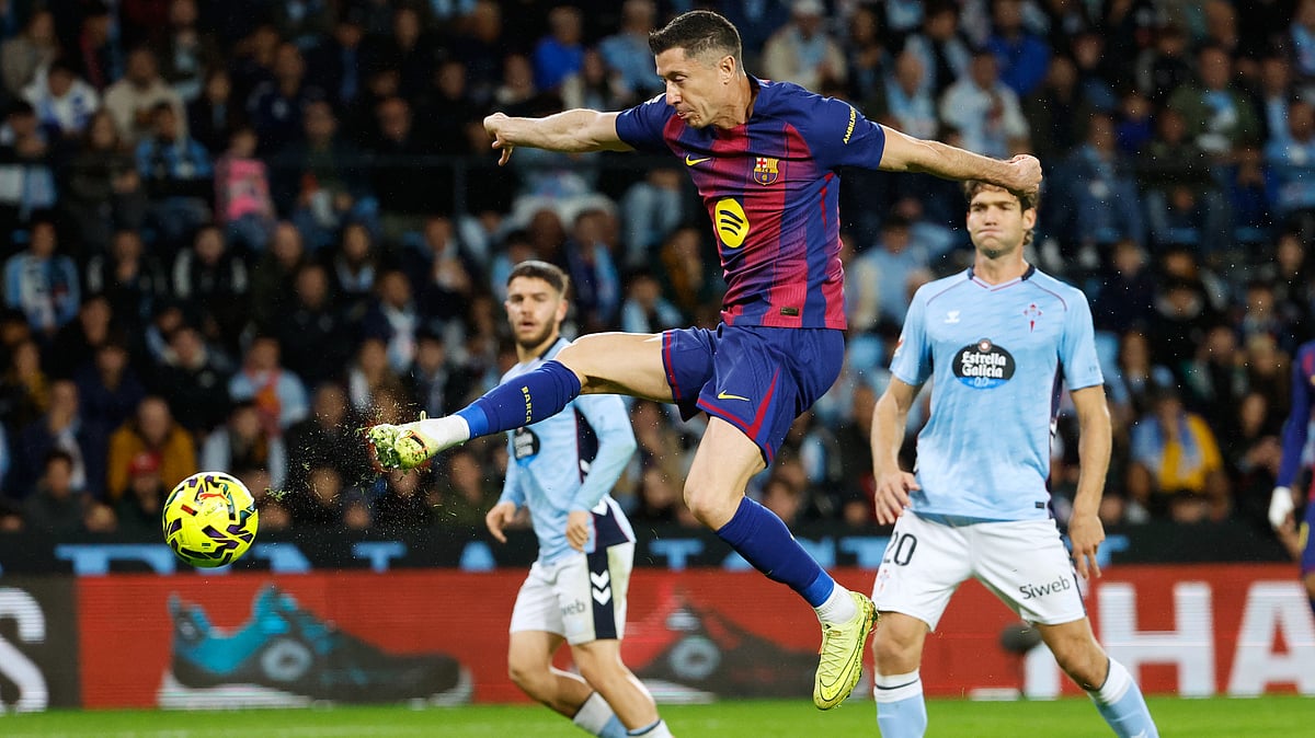 AP/Lalo R. Villar : Robert Lewandowski (c) scored two goals for Barca in their match against Celta Vigo.