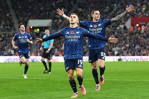 Arsenal's Leandro Trossard (centre) celebrates scoring their side's second goal of the game with team-mates during the English Premier League soccer match between Arsenal and Sunderland, in Sunderland, England.