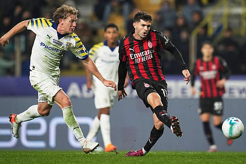 AC Milan's Christian Pulisic fights for the ball with Parma's Oliver Sorensen Jensen during the Serie A soccer match between Parma and Milan in Parma, Italy.