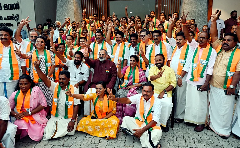 BJP President Rajeev Chandrasekhar poses for a photograph with all BJP candidates contesting the upcoming Kerala local body elections - PTI