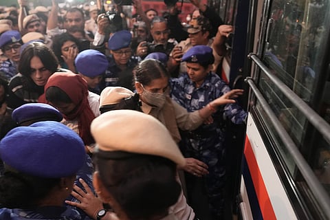 Dozens were detained at India Gate during a clean air protest in New Delhi.
