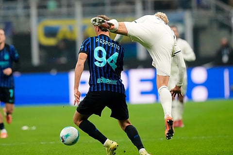 Inter Milan's Francesco Pio Esposito is challenged by Lazio's Oliver Provstgaard, right, during a Serie A soccer match between Inter Milan and Lazio, in Milan, Italy.