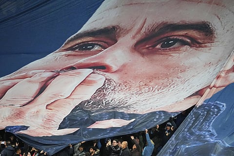 Fans tribute to Pep Guardiola coach of Manchester City 1000th game during the English Premier League soccer match between Manchester City and Liverpool in Manchester, England.