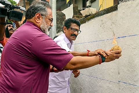 BJP State President Rajeev Chandrasekhar with a party leader performs rituals during an election campaign for the upcoming Kerala local body polls, in Thiruvananthapuram. The Kerala local body elections will be held in two phases on December 9 and 11, with counting on December 13. 