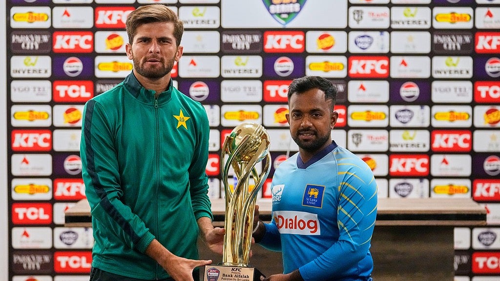 AP : Pakistan's skipper Shaheen Shah Afridi, left, and his Sri Lankan counterpart Charith Asalanka pose with the ODI series trophy in Rawalpindi.
