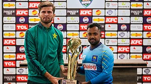 AP : Pakistan's skipper Shaheen Shah Afridi, left, and his Sri Lankan counterpart Charith Asalanka pose with the ODI series trophy in Rawalpindi.