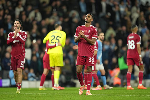 Liverpool players react disappointed after the English Premier League soccer match between Manchester City and Liverpool in Manchester, England.