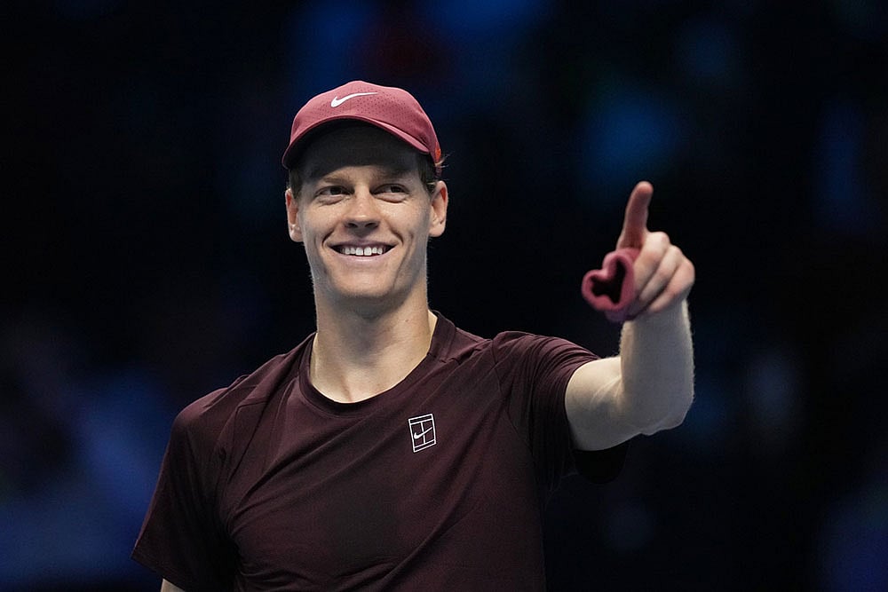 | Photo: AP/Antonio Calanni : Italy's Jannik Sinner celebrates after winning against Canada's Felix Auger-Aliassime during their tennis match of the ATP World Tour Finals, in Turin, Italy.