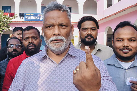 MP Pappu Yadav shows his ink-marked finger after casting vote at a polling station during the second and final phase of the Bihar Assembly elections, in Purnia, Bihar.