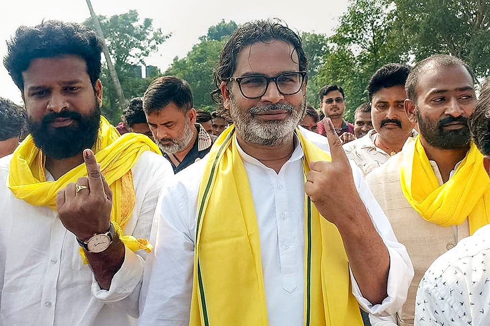 Photo: PTI : Jan Suraaj leader Prashant Kishor shows his ink-marked finger after casting a vote during the second and final phase of the Bihar Assembly elections, in Rohtas.