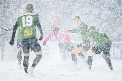 Atletico Ottawa's Kévin David Nogueira Carvalho Dos Santos (19) heads the ball as Cavalry FC's Eryk Kobza (24) fights to gain possession during second half Canadian Premier League finals soccer action in Ottawa.