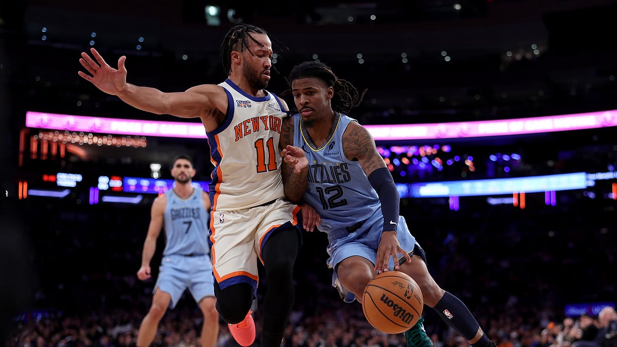 Ja Morant #12 of the Memphis Grizzlies heads for the net as Jalen Brunson #11 of the New York Knicks defends in the fourth quarter at Madison Square Garden on November 11, 2025 in New York City. The New York Knicks defeated the Memphis Grizzlies 133-120.