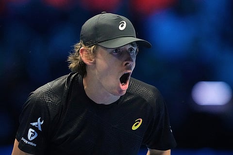 Australia's Alex de Minaur reacts after winning a set point against Italy's Lorenzo Musetti during their tennis match of the ATP World Tour Finals, in Turin, Italy.