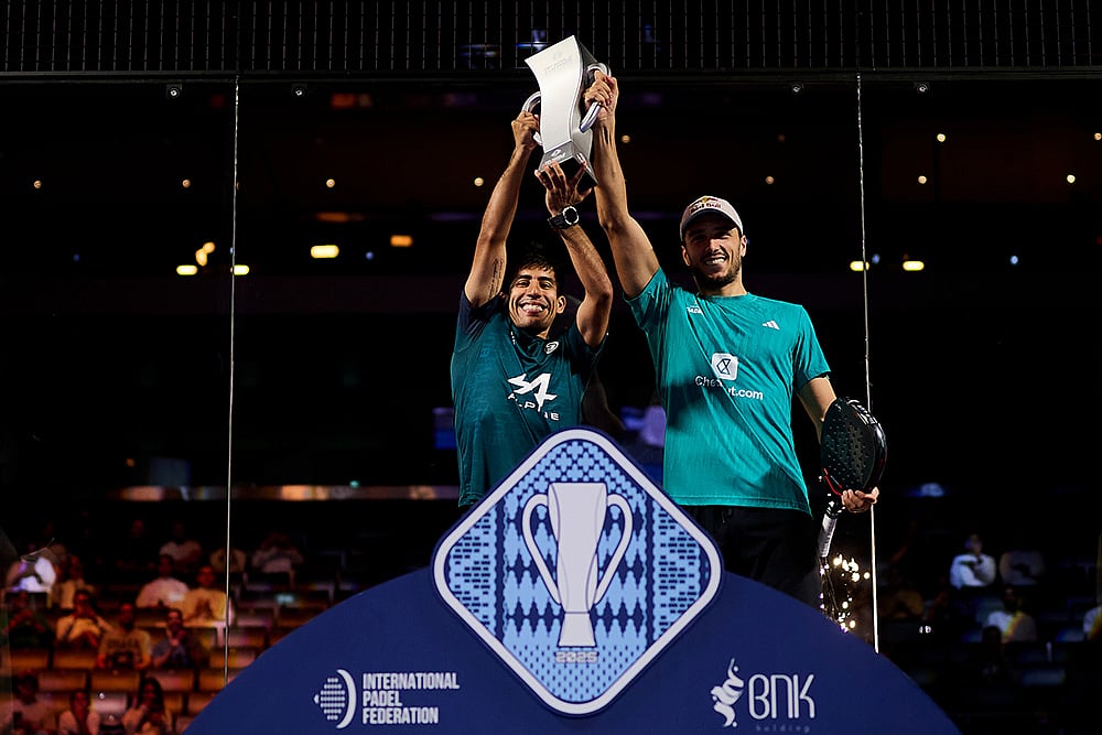 | Photo: Premier Padel / Red Bull Content Pool : Federico Chingotto and Alejandro Galan pose with their winner trophies during the trophy ceremony of the FIP World Cup in Pairs, Kuwait on November 9, 2025.