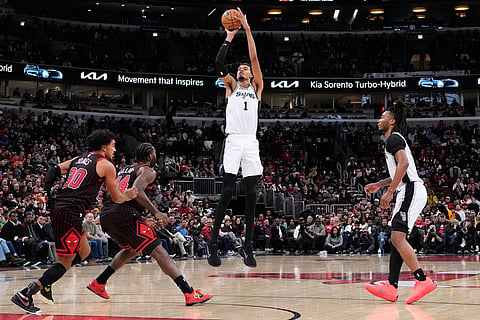 San Antonio Spurs forward Victor Wembanyama (1) goes up to shoot against the Chicago Bulls during the second half of an NBA basketball game in Chicago.
