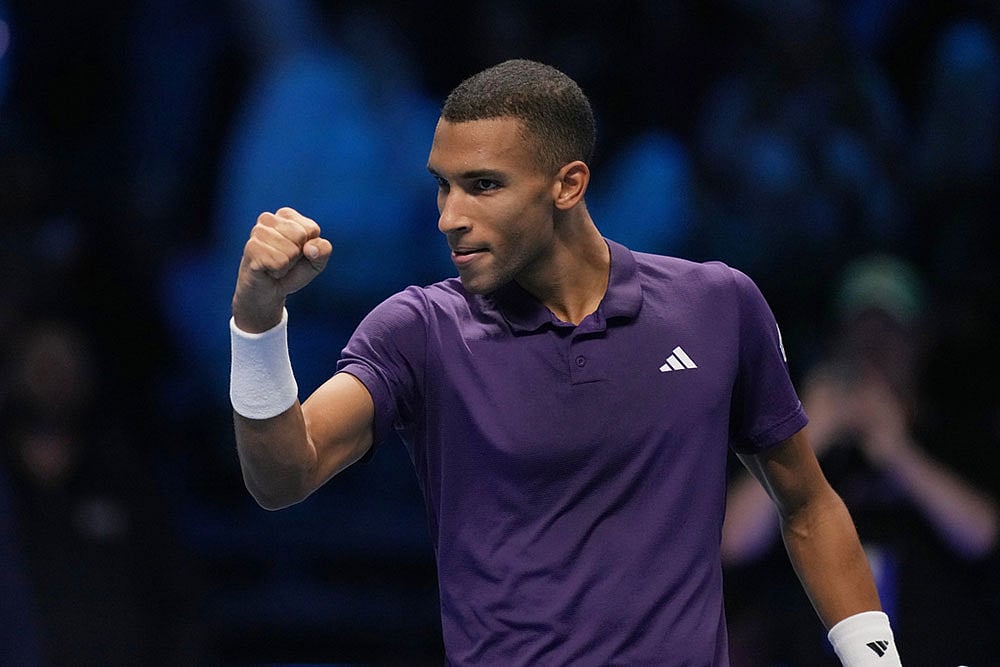 | Photo: AP/Antonio Calanni : Canada's Felix Auger-Aliassime celebrates after winning against United States' Ben Shelton during their tennis match of the ATP World Tour Finals, in Turin, Italy.
