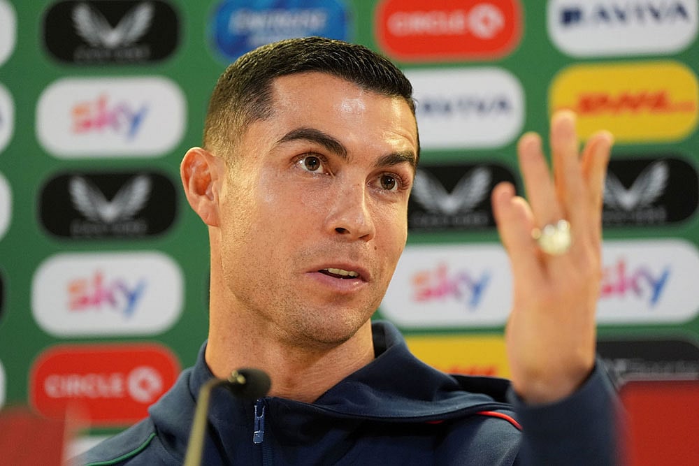 | Photo: Brian Lawless/PA via AP : Portugal's Cristiano Ronaldo speaks during a press conference in Dublin, Ireland, ahead of Thursday's World Cup qualifying soccer match against Ireland.