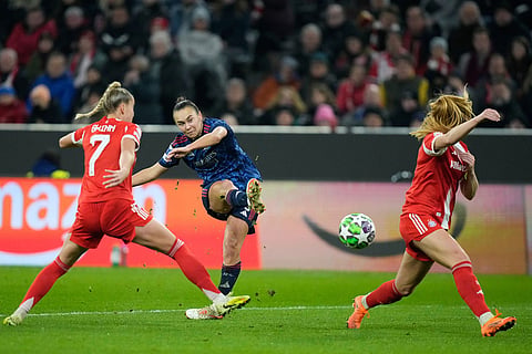 Arsenal's Caitlin Foord attempts a shot at goal during the women's Champions League opening phase soccer match between FC Bayern Munich and Arsenal FC in Munich, Germany.