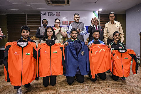 Athletes display their kits as Sports Secretary Hari Ranjan Rao, along with members of the Sports Authority of India and the All India Sports Council of the Deaf, attends the kit unveiling and send-off ceremony for the Indian contingent participating in the Deaflympics, to be held from Nov. 15 to 26 in Tokyo, at Jawaharlal Nehru Stadium, in New Delhi.