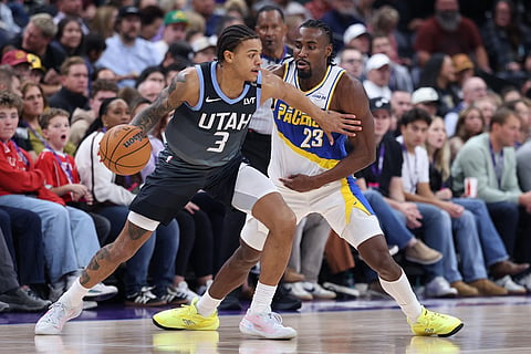 Utah Jazz guard Keyonte George (3) moves the ball against Indiana Pacers guard Aaron Nesmith (23) during the second half of an NBA basketball game in Salt Lake City. 